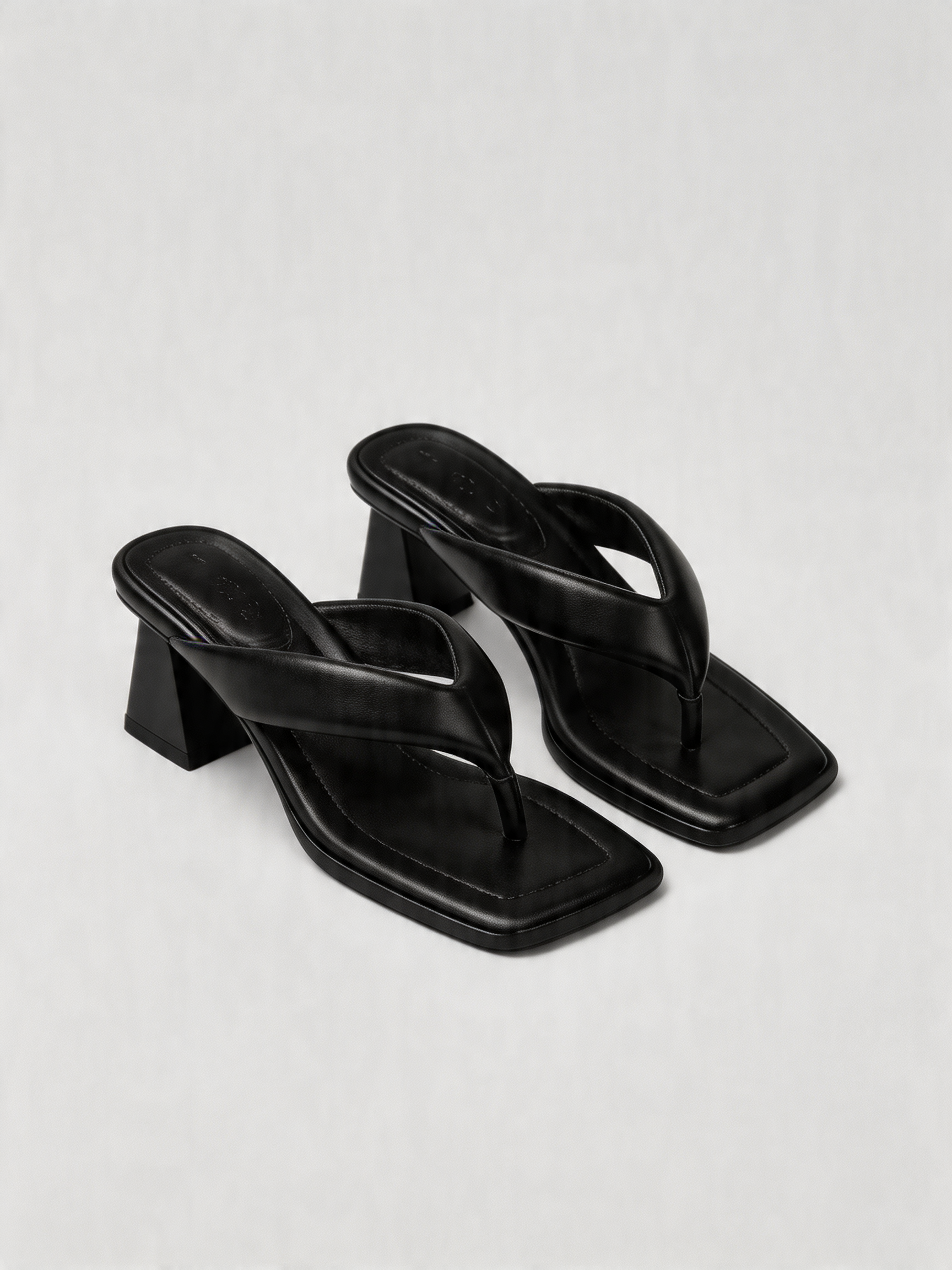 Black leather thong heel mule square toe sculptural block heel padded strap women's