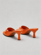 Patent curved heel mule square open toe tangerine orange top view women's
Patent curved heel mule square open toe tangerine orange side view women's
Patent curved heel mule square open toe tangerine orange heel detail women's